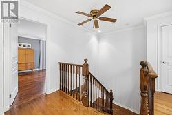 Hardwood Flooring Flows Throughout Upper Hallway - 