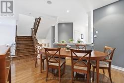 Elegant Dining Area Features Hardwood Flooring - 