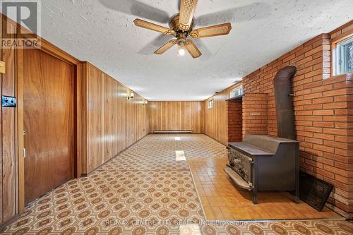 Rec Room with Wood Burning Stove - 23171 Talbot Line, West Elgin, ON 