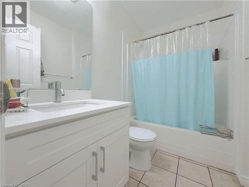 White vanity with a single basin sink, chrome faucet, and integrated mirror - 78 Colton Circle, Kitchener, ON 