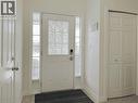 Entryway featuring a white paneled door with decorative frosted glass, sidelight windows, and a digital lock - 78 Colton Circle, Kitchener, ON 