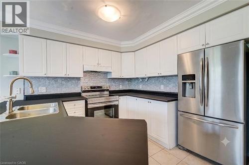 virtually staged with fridge - 182 Kerwood Drive, Cambridge, ON - Indoor Photo Showing Kitchen With Double Sink