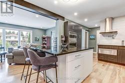 Kitchen island with breakfast bar - 