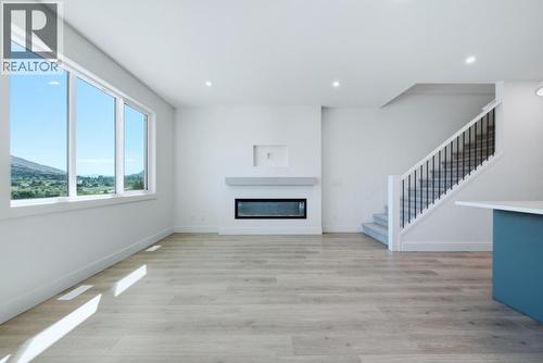 377 Arrowleaf Rise, Coldstream, BC - Indoor With Fireplace