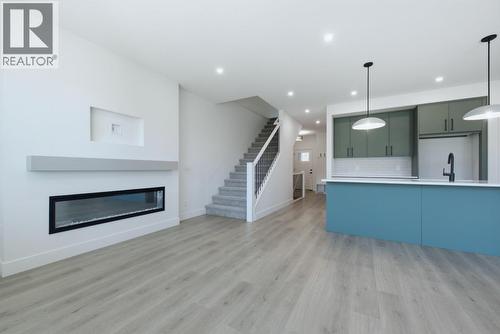 377 Arrowleaf Rise, Coldstream, BC - Indoor With Fireplace