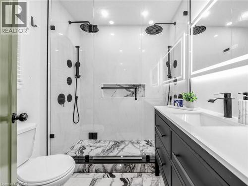 3 piece Ensuite bathroom- Walk-in shower with dual rain shower heads, matte black fixtures, and a recessed niche - 13 Swanhurst Boulevard, Mississauga, ON - Indoor Photo Showing Bathroom