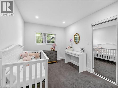 Room featuring recessed lighting, a window with horizontal blinds, gray patterned carpeting, and a mirrored closet door - 13 Swanhurst Boulevard, Mississauga, ON - Indoor Photo Showing Bedroom