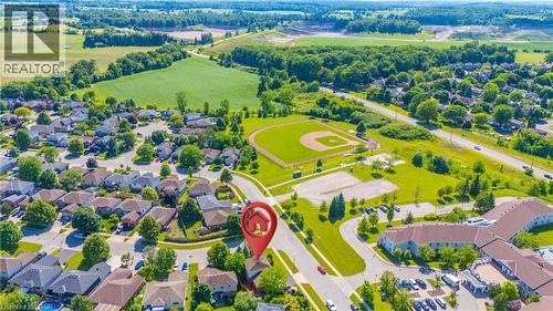 Aerial perspective showcasing a residential neighborhood with surrounding green spaces - 191 Stirling Macgregor Drive, Cambridge, ON 