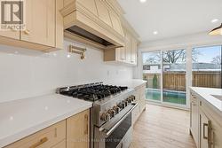 The Custom Kitchen Features a JennAir Gas Range - 
