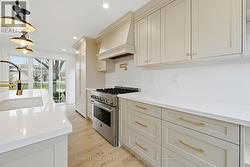The Custom Kitchen Features a JennAir Gas Range - 