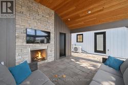 Covered Outdoor Living Area with a Gas Fireplace - 