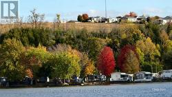 Homes on the hill seasonal trailers on the water. - 