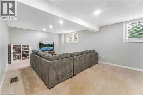 Carpeted floor with recessed lighting, light gray walls, and white trim - 23 Millpond Place, Mountain, ON 
