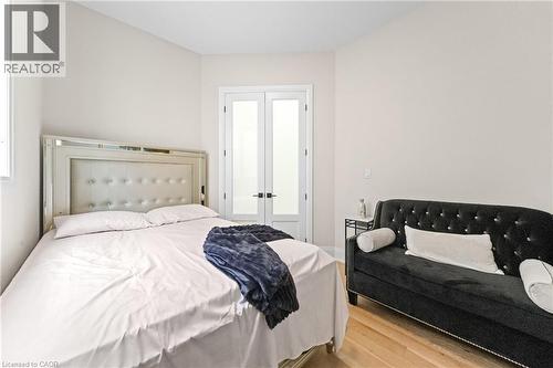 Bright interior space featuring light-toned walls and wood-finish flooring - 130 Pondcliffe Drive, Kitchener, ON 