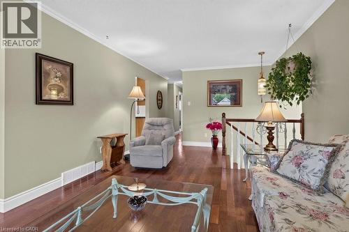 Hardwood-finish flooring extending throughout the living space - 409 Mohawk Road W, Hamilton, ON 