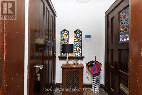 Hallway with stone floor and stained glass windows - 52 Yates Street, St. Catharines (Downtown), ON 
