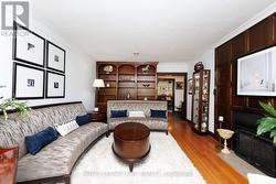 Built in wooden cabinetry and gas fireplace. - 