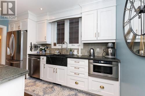Galley kitchen with sandstone countertops. - 52 Yates Street, St. Catharines (Downtown), ON 