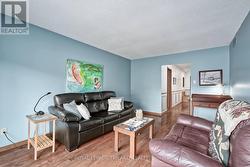 Main floor living room opens to a balcony - 