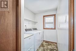 main floor laundry with inside entrance to garage - 