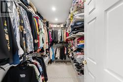 Large Walk In Closet with organizers. - 