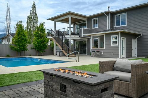 631 Mt Ida Crescent, Coldstream, BC - Outdoor With In Ground Pool With Deck Patio Veranda