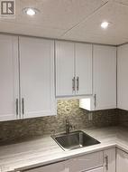 Unit A Kitchen. Before current Tenant. - 