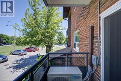 Private balcony featuring a black metal and glass railing system - 