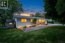 Ranch-style residence featuring white horizontal siding and a dark shingle roof - 176 Riverbank Drive, Cambridge, ON 