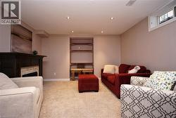 Neutral-toned walls complement the recessed lighting and plush carpeting - 