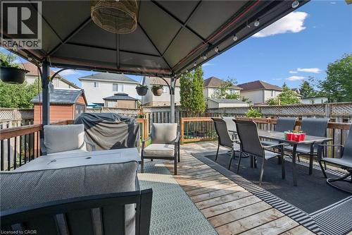 Spacious wooden deck with a dark metal gazebo, complete with string lighting - 765 Angler Way, Waterloo, ON 