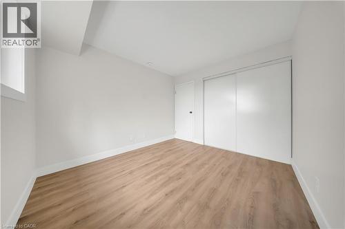Neutral wall tones with wood-finish flooring - 3085 Kingsway Drive Unit# 21, Kitchener, ON 
