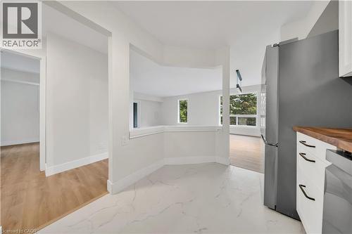 Kitchen area with white marble-look tile flooring - 3085 Kingsway Drive Unit# 21, Kitchener, ON 