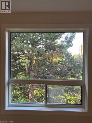 White-framed window with a large upper pane and two lower panes - 3085 Kingsway Drive Unit# 21, Kitchener, ON 