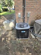 Exterior brick wall with two outdoor HVAC units - 