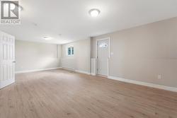 Spacious recreation/family room with access to the backyard - 