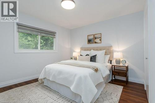 Room featuring wood-finish flooring, white baseboards, and light-colored walls - 139 Mackay Crescent, Waterloo, ON 