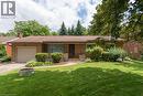 Brick ranch-style residence featuring an attached garage, a brown shingle roof, and a stone facade entry - 139 Mackay Crescent, Waterloo, ON  - Outdoor 