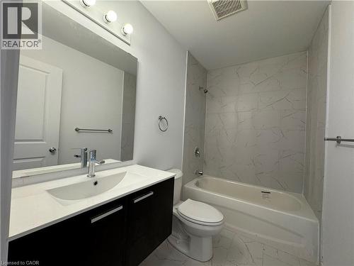 Contemporary bathroom featuring a floating vanity with a white countertop and integrated sink - 113 Highriver Trail Unit# Main, Welland, ON - Indoor Photo Showing Bathroom