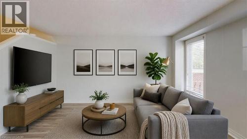 Living area featuring wood-finish flooring, a contemporary media console, and a window with white blinds - Virtually staged - 980 Creekside Drive, Waterloo, ON - Indoor Photo Showing Living Room