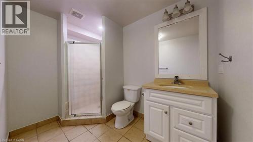 Bathroom featuring a corner vanity with a light-colored countertop and a framed mirror - 980 Creekside Drive, Waterloo, ON - Indoor Photo Showing Bathroom