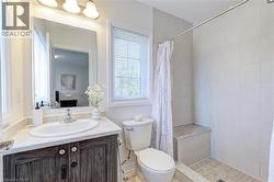 Bathroom with a tiled walk-in shower featuring a built-in bench - 