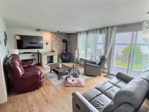 Salon - 127 Ch. Des Scouts, Val-D'Or, QC - Indoor Photo Showing Living Room With Fireplace