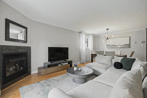 Living Room - 1-185 Rue Du Sanctuaire, Sainte-Julie, QC - Indoor Photo Showing Living Room With Fireplace