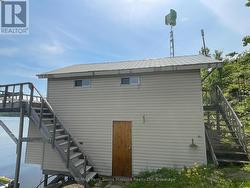 Boathouse with guest accommodation above - 