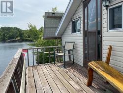 Guest accommodation deck overlooking water - 