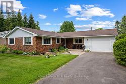 Paved lane leading to single car garage - 