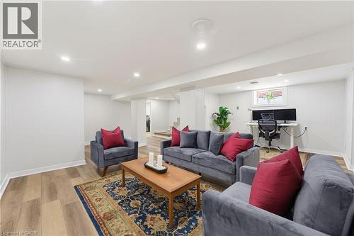 Finished lower level with wood-finish flooring and recessed lighting - 282 East 13Th Street, Hamilton, ON 