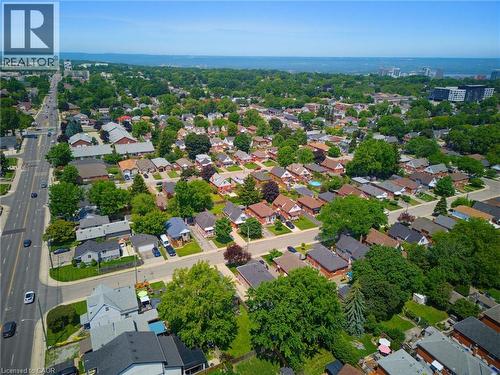 Expansive aerial capturing a residential area with a prominent multi-lane thoroughfare - 282 East 13Th Street, Hamilton, ON 