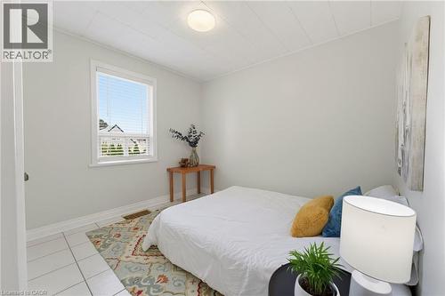 Bright room featuring white tile flooring and light-toned walls - 282 East 13Th Street, Hamilton, ON - Indoor Photo Showing Bedroom